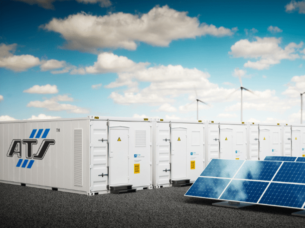Energy storage facility being powered by solar panels and wind turbines.