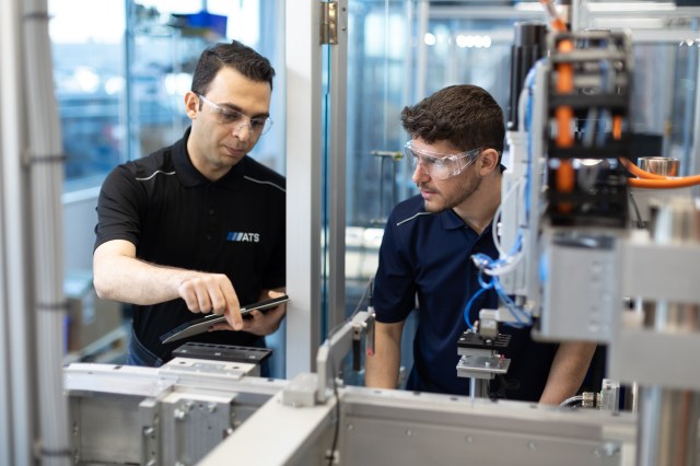 ATS Employees Working on Equipment