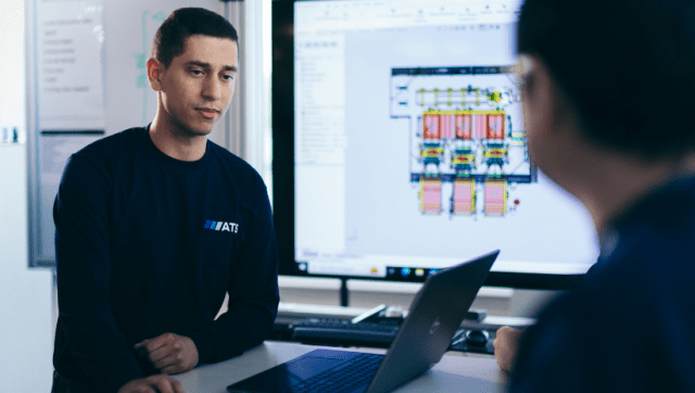 ATS employee working on battery manufacturing line