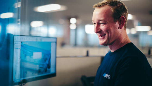 ATS employee working with digital technology