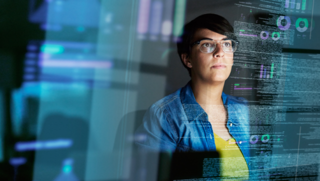 Women working in a manufacturing environment with digital tools