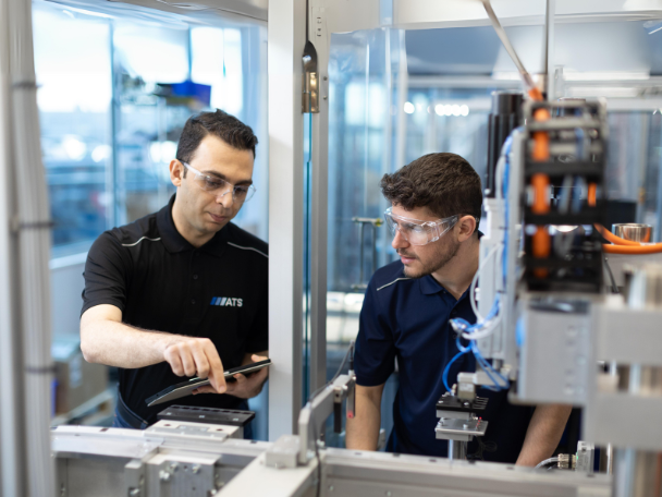 Automation Team Working on Equipment