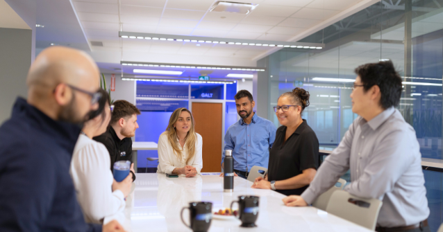 ATS team discussing a project in a meeting room