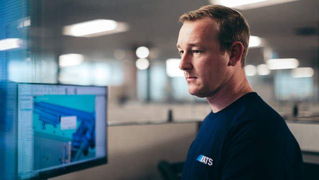 ATS Employee working on manufacturing line