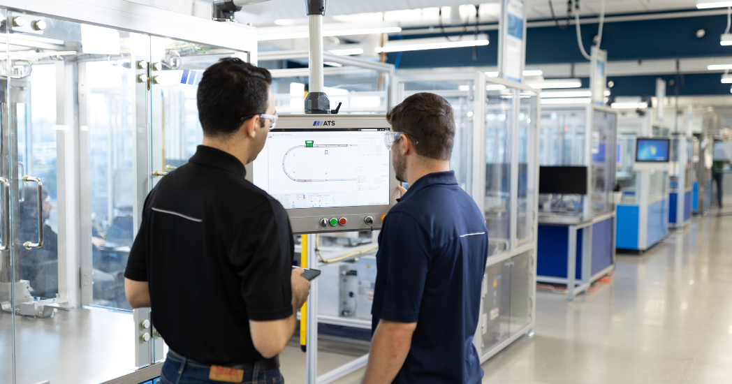 ATS Employees working on Automation Equipment ATS Employees working on Automation Equipment