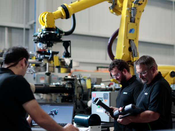 ATS team members working on nuclear tooling and automation equipment