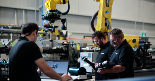 ATS team members working on nuclear tooling and automation equipment