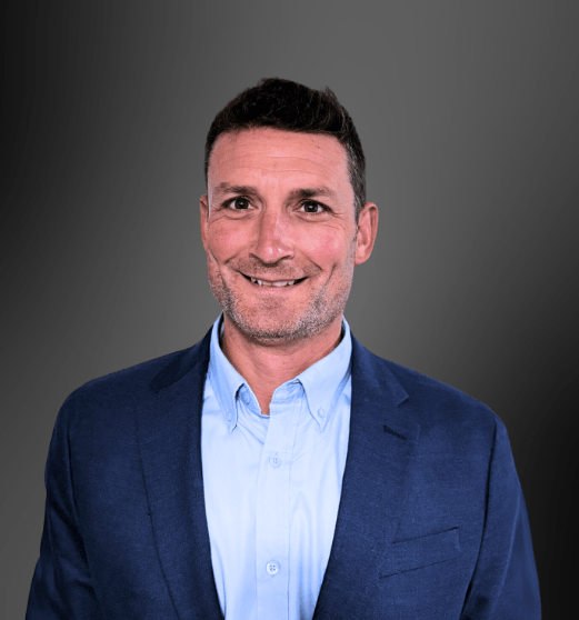 Two individuals working on automation equipment